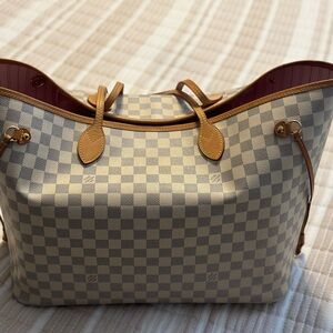 Designer-only the wristlet is authentic. All either new or gently used.